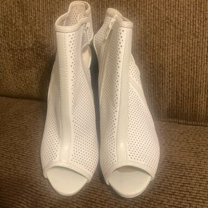 Cream leather open toe bootie… perforated design from Aldo